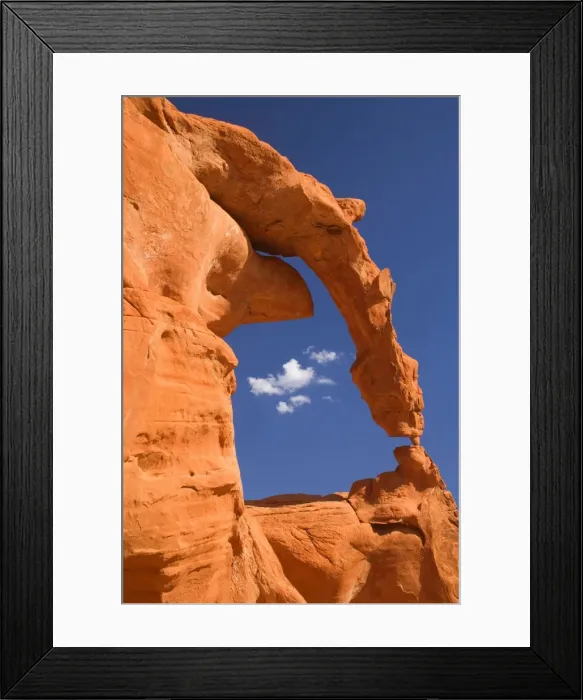 Framed Print : Ephemeral Arch - fragile and delicately sculptured arch of red sandstone - arch and its base are supported only by a little piece of rock the size of a thumb Framed Print : Ephemeral Arch - fragile and delicately sculptured arch of red sandstone - arch and its base are supported only by a little piece of rock the size of a thumb