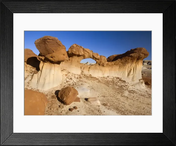 Framed Print : Chocolate Arch - brown rock arch sitting in a clay pan amidst Badlands - Bisti Badlands Wilderness Area - New Mexico - USA Framed Print : Chocolate Arch - brown rock arch sitting in a clay pan amidst Badlands - Bisti Badlands Wilderness Area - New Mexico - USA