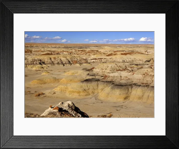 Framed Print : Badlands - view into a valley of badlands. The colours range from yellow to ocre and black - Bisti Badlands Wilderness Area, New Mexico, USA Framed Print : Badlands - view into a valley of badlands. The colours range from yellow to ocre and black - Bisti Badlands Wilderness Area, New Mexico, USA