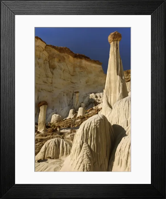 Framed Print : White Ghosts - the Wahweap Hoodoos are white pedestral rocks of silt-stone some of them topped by brown rocks - pedestrals are eroded by water creating an intricate pattern of vertical furrows Framed Print : White Ghosts - the Wahweap Hoodoos are white pedestral rocks of silt-stone some of them topped by brown rocks - pedestrals are eroded by water creating an intricate pattern of vertical furrows