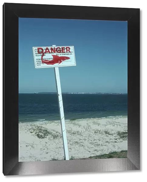 Shark Warning sign - these signs are off most swimming beaches. This one is aimed at tourists who do not speak english. Brighton Beach, NSW Australia