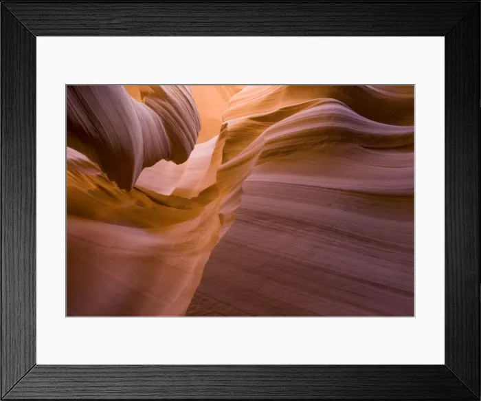 Framed Print : USA - Light that penetrates into the narrow canyon walls creates beautiful hues on the graceful curves of sandstone rock in the Lower Antelope Canyon, probably the most famous slot canyon in the Southwest. Antelope Canyon Framed Print : USA - Light that penetrates into the narrow canyon walls creates beautiful hues on the graceful curves of sandstone rock in the Lower Antelope Canyon, probably the most famous slot canyon in the Southwest. Antelope Canyon