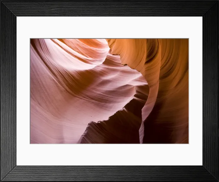 Framed Print : USA - Light that penetrates into the narrow canyon walls creates beautiful hues on the graceful curves of sandstone rock in the Lower Antelope Canyon, probably the most famous slot canyon in the Southwest. Antelope Canyon Framed Print : USA - Light that penetrates into the narrow canyon walls creates beautiful hues on the graceful curves of sandstone rock in the Lower Antelope Canyon, probably the most famous slot canyon in the Southwest. Antelope Canyon