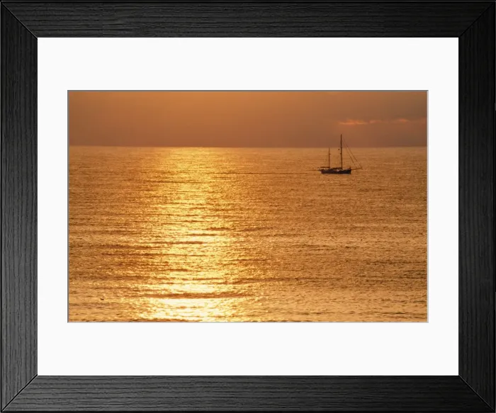 Framed Print : Sunset - over sea with small boat Framed Print : Sunset - over sea with small boat
