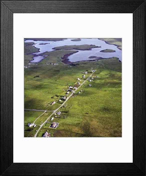Framed Print : Aerial image of Scotland, UK: Callanish, a village (township), situated on a headland jutting into a sea loch, Loch Roag, near Stornoway, West Side of the Isle of Lewis, Outer Hebrides, West Coast Scotland Framed Print : Aerial image of Scotland, UK: Callanish, a village (township), situated on a headland jutting into a sea loch, Loch Roag, near Stornoway, West Side of the Isle of Lewis, Outer Hebrides, West Coast Scotland