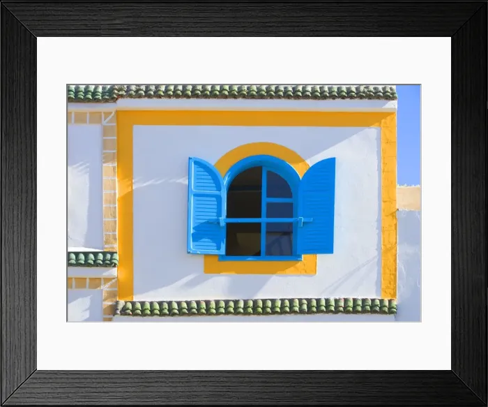 Framed Print : Morocco - brightly coloured house wall & window Framed Print : Morocco - brightly coloured house wall & window