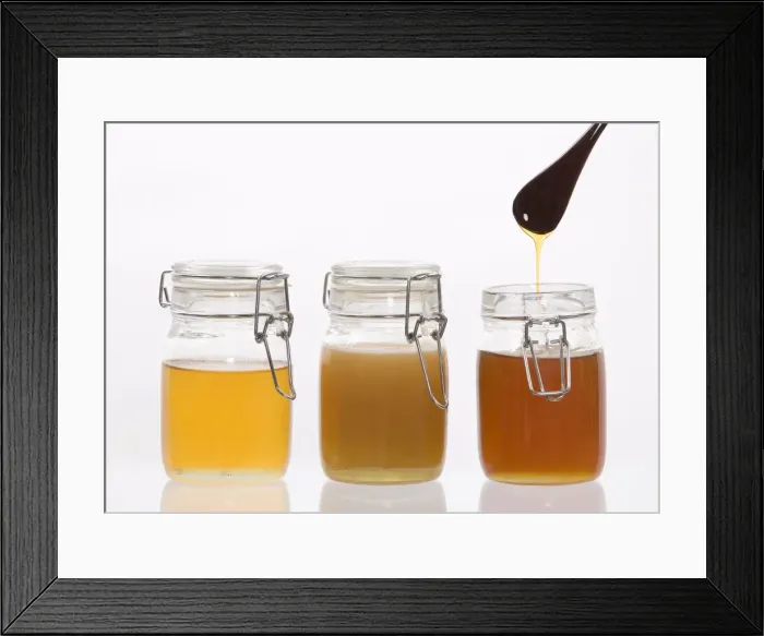 Framed Print : Honey - in jars in studio Framed Print : Honey - in jars in studio