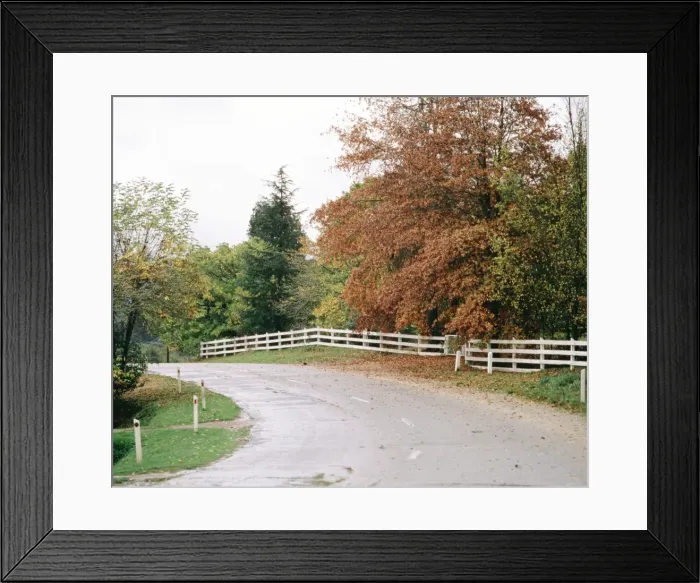 Framed Print : Sealed road and fence near Bright, Victoria, Australia JLR02247