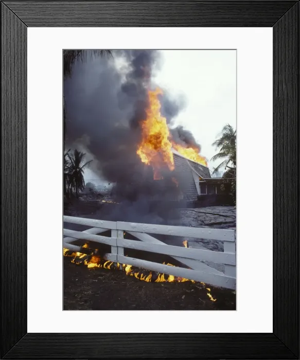 Framed Print : USA - Hawaii - Big Island - Eruption of the Pu'u O'o Vent - a vent of the Kilauea Volcano - in the village of Kalapana Gardens a house surrounded by lava erupts in flames Framed Print : USA - Hawaii - Big Island - Eruption of the Pu'u O'o Vent - a vent of the Kilauea Volcano - in the village of Kalapana Gardens a house surrounded by lava erupts in flames
