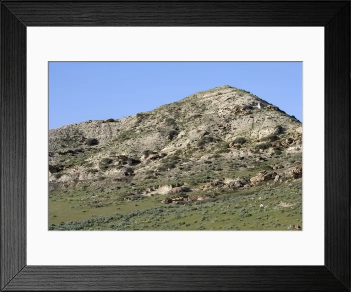 Framed Print : GEOLOGY: K-T boundary site The photo depicts a hill near the town of Sussex, north of Casper, Wyoming, USA. The KT boundary layer is located on top of the grey sediments near the base of the hill