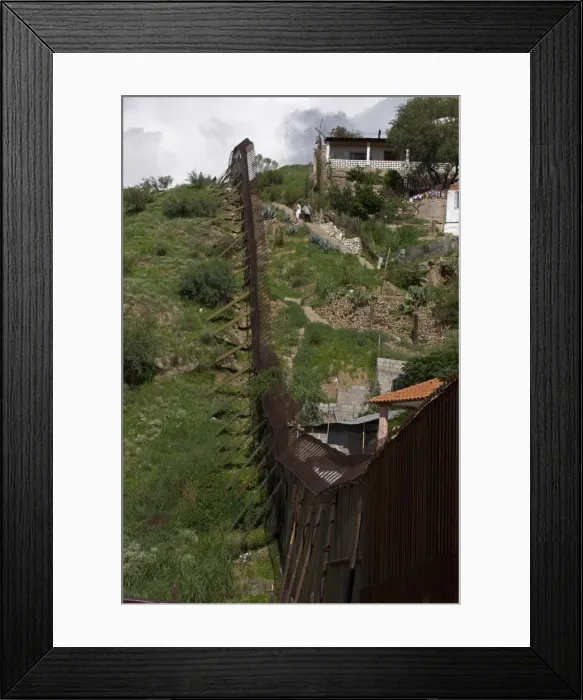 Framed Print : Border fence between Nogales Sonora Mexico (right) and Nogales Arizona USA Framed Print : Border fence between Nogales Sonora Mexico (right) and Nogales Arizona USA