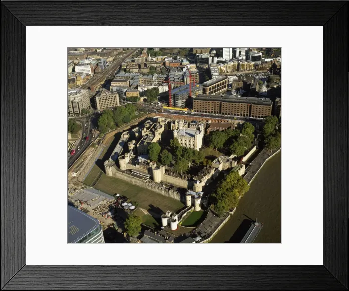 Framed Print : Aerial image of London, England, UK: Tower of London (Her Majesty's Royal Palace and Fortress), a historic fortress and scheduled monument on the north bank of the River Thames Framed Print : Aerial image of London, England, UK: Tower of London (Her Majesty's Royal Palace and Fortress), a historic fortress and scheduled monument on the north bank of the River Thames