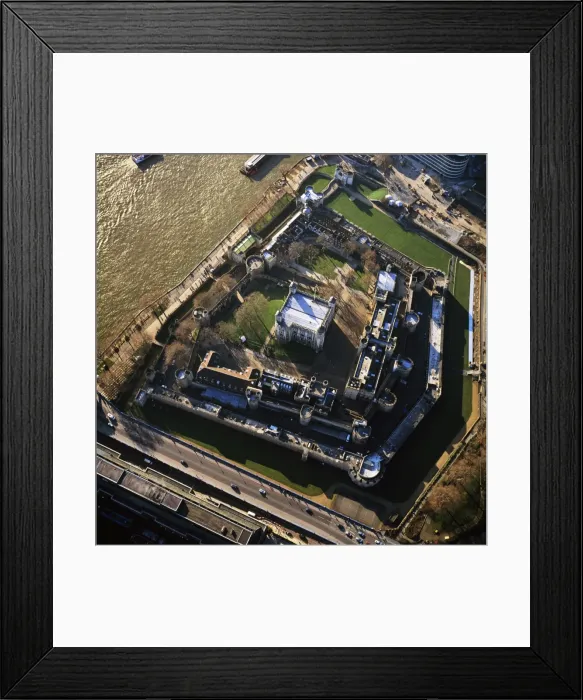 Framed Print : Aerial image of London, England, UK: Tower of London (Her Majesty's Royal Palace and Fortress), a historic fortress and scheduled monument on the north bank of the River Thames Framed Print : Aerial image of London, England, UK: Tower of London (Her Majesty's Royal Palace and Fortress), a historic fortress and scheduled monument on the north bank of the River Thames