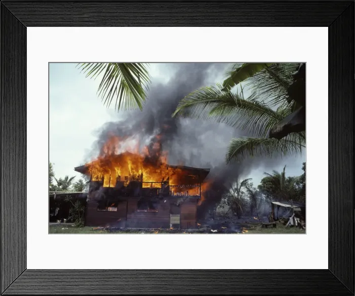 Framed Print : USA - Hawaii - Big Island - Eruption of the Pu'u O'o Vent - a vent of the Kilauea Volcano - in the village of Kalapana Gardens a house surrounded by lava erupts in flames Framed Print : USA - Hawaii - Big Island - Eruption of the Pu'u O'o Vent - a vent of the Kilauea Volcano - in the village of Kalapana Gardens a house surrounded by lava erupts in flames