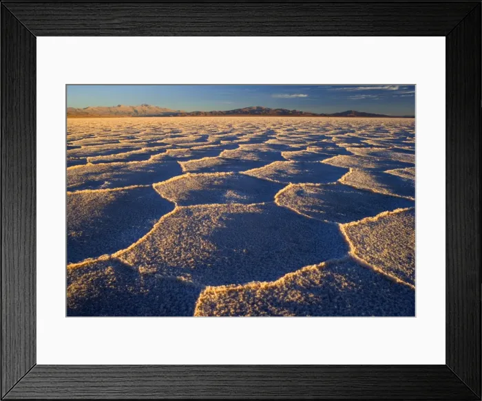 Framed Print : Salinas Grandes del Noroeste - mountains and dried-up salt lake showing a regular polygonal pattern created by salt crystals - at sunrise - the salinas are located on an altitude of 3450 m above sea level on the so-called Altiplano - Prov Framed Print : Salinas Grandes del Noroeste - mountains and dried-up salt lake showing a regular polygonal pattern created by salt crystals - at sunrise - the salinas are located on an altitude of 3450 m above sea level on the so-called Altiplano - Prov