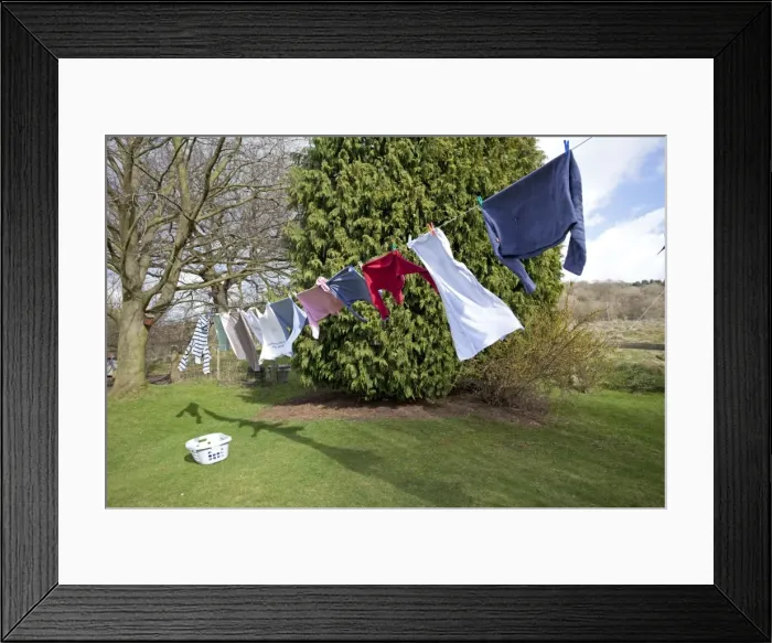 Framed Print : Washing line with clothes drying in the wind Cotswolds UK Framed Print : Washing line with clothes drying in the wind Cotswolds UK