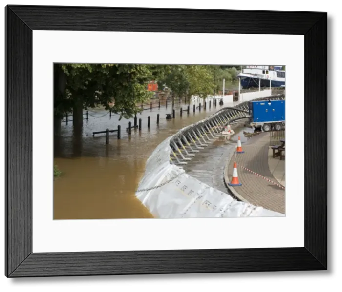 Framed Print : Flood barriers alongside flooded River Severn in spate June 27 2007 - Upton upon Severn Worcs UK