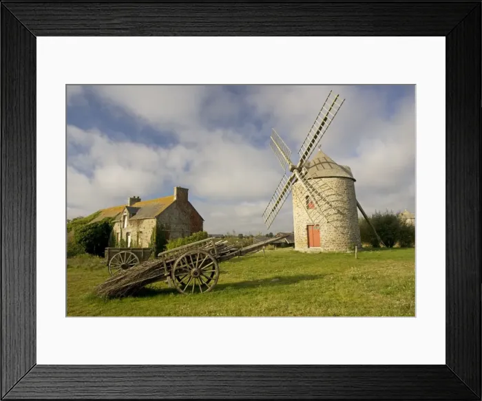 Framed Print : Restored French windmill with old wood cart in foreground near Cherrueiux Brittany France Framed Print : Restored French windmill with old wood cart in foreground near Cherrueiux Brittany France