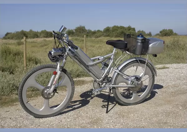 Modern electric bicycle with strong but lightweight frame, solid wheels, disk brakes, and special luggage carriers, France