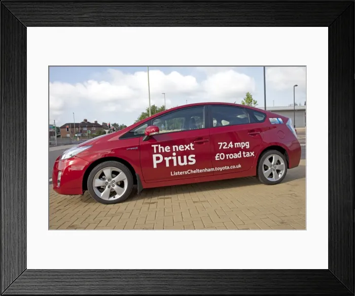 Framed Print : New Prius T3 hybrid red motor car fuel consumption - August 2009 parked outside Homebase in Cheltenham - Currently the world's most advanced hybrid car capable of more than 75 mpg Framed Print : New Prius T3 hybrid red motor car fuel consumption - August 2009 parked outside Homebase in Cheltenham - Currently the world's most advanced hybrid car capable of more than 75 mpg