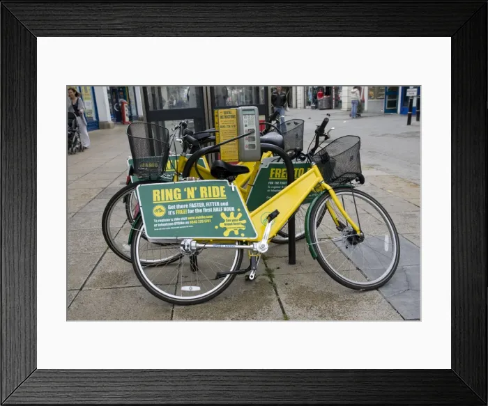 Framed Print : Ring N Ride OYB yellow bike rental docking station Cheltenham High Street Gloucestershire UK Framed Print : Ring N Ride OYB yellow bike rental docking station Cheltenham High Street Gloucestershire UK