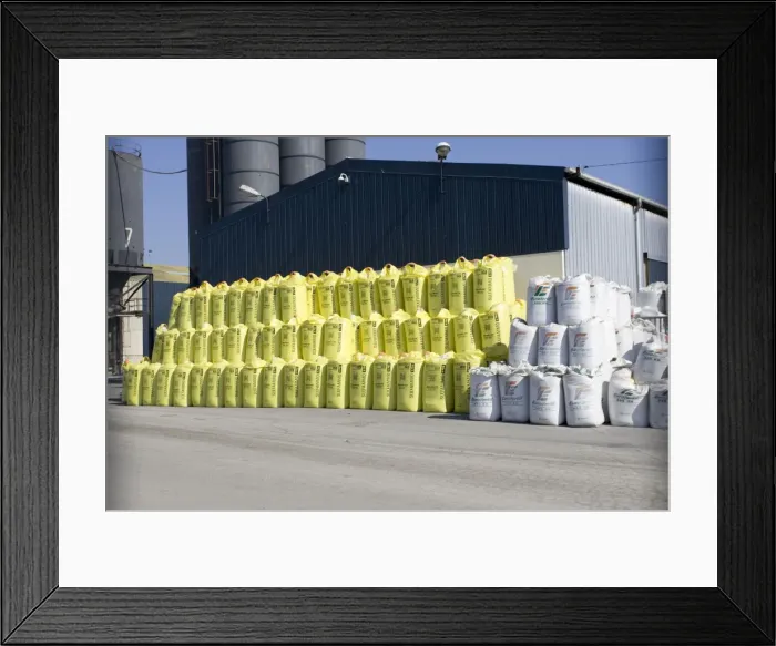 Framed Print : Stacks of fertiliser sacks on dockside St Malo Brittany, France Framed Print : Stacks of fertiliser sacks on dockside St Malo Brittany, France