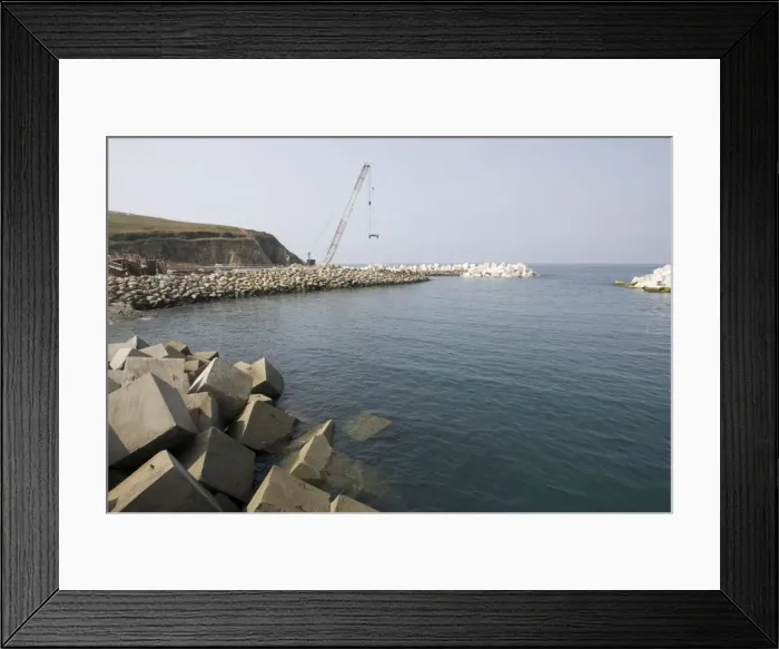 Framed Print : Constructing new breakwater outside harbour Puerto de Vega Costa Verde Northern Spain Framed Print : Constructing new breakwater outside harbour Puerto de Vega Costa Verde Northern Spain