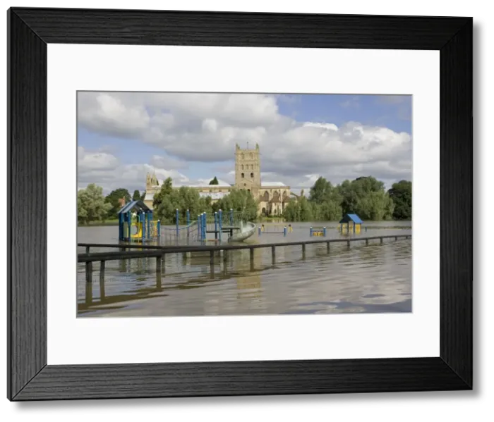 Framed Print : Flooding - childrens playground underwater with Tewkesbury Abbey in background. Unprecedented flooding of the Rivers Severn and Avon July 2007 Gloucestershire UK Framed Print : Flooding - childrens playground underwater with Tewkesbury Abbey in background. Unprecedented flooding of the Rivers Severn and Avon July 2007 Gloucestershire UK