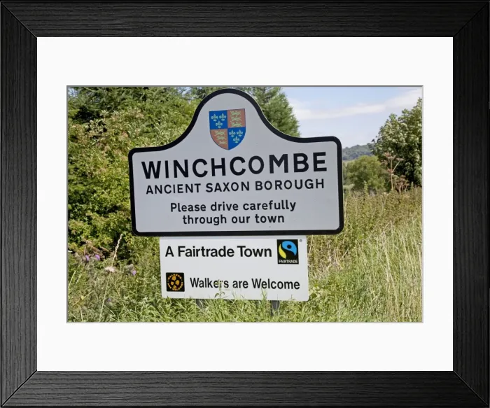 Framed Print : Fairtrade town notice on roadside approaching Winchcombe - Gloucestershire - UK Framed Print : Fairtrade town notice on roadside approaching Winchcombe - Gloucestershire - UK
