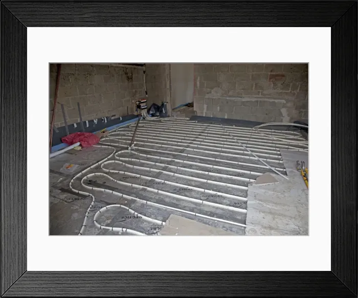 Framed Print : Installing underfloor heating pipes in new office building - Cheltenham - UK Framed Print : Installing underfloor heating pipes in new office building - Cheltenham - UK