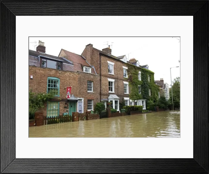 Framed Print : Flooded road and houses opposite Tewkesbury Abbey Gloucestershire UK Level of Rivers Avon and Severn almost at 1947 levels on July 21 2007 Framed Print : Flooded road and houses opposite Tewkesbury Abbey Gloucestershire UK Level of Rivers Avon and Severn almost at 1947 levels on July 21 2007