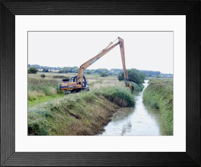 Framed Print : Digging out a ditch on one side only to avoid breaking insect life cycles and to preserve nesting habitat along one bank. Minsmere, Suffolk