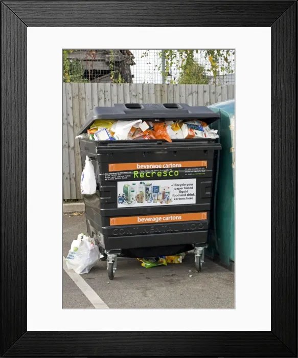 Framed Print : Beverage carton recycling black bin Recresco Tesco car park Bishops Cleeve Cheltenham UK Framed Print : Beverage carton recycling black bin Recresco Tesco car park Bishops Cleeve Cheltenham UK