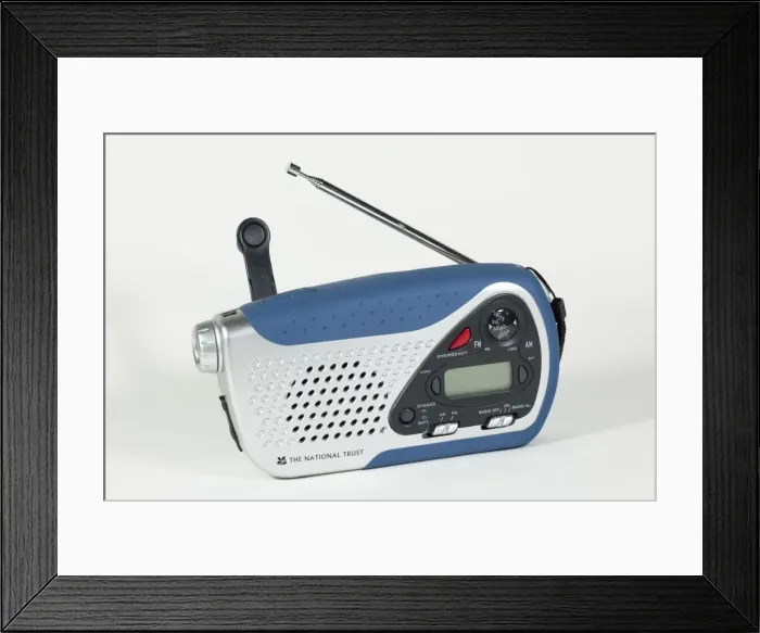 Framed Print : Small windup clockwork dual band radio with with in torchlight and battery options UK Framed Print : Small windup clockwork dual band radio with with in torchlight and battery options UK