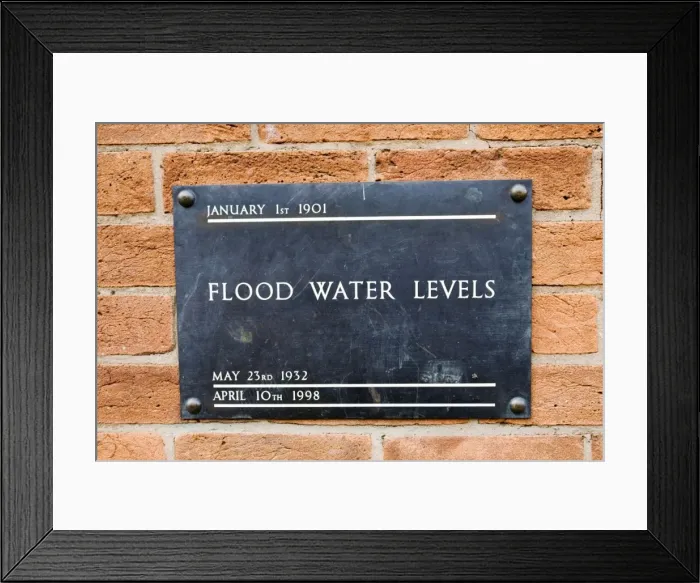 Framed Print : UK - Brass plate displaying high flood levels on wall of house in Stratford upon Avon Framed Print : UK - Brass plate displaying high flood levels on wall of house in Stratford upon Avon