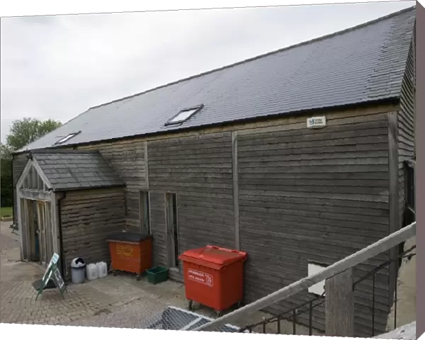 Photovoltaic shingle tile roof - on Brockweir & Hewelsfield Village Shop Forest of Dean UK. Almost the entire roof is photovolatic shingles with just a small strip of ordinary tiles on each side