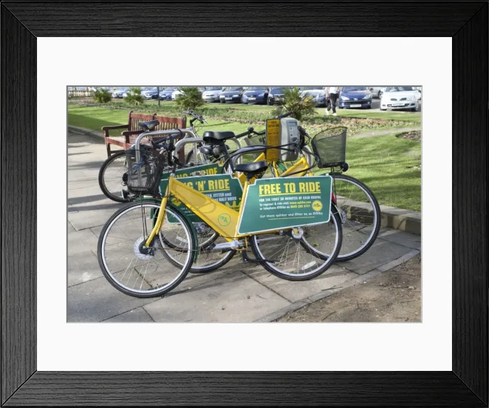 Framed Print : Free to Ride OYB yellow bike rental docking station - Cheltenham Promenade Gloucestershire UK Framed Print : Free to Ride OYB yellow bike rental docking station - Cheltenham Promenade Gloucestershire UK