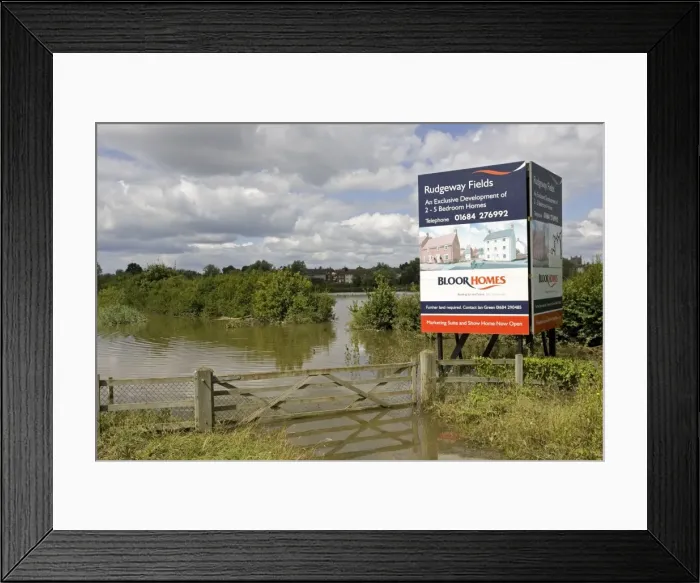 Framed Print : Flooding - Large bill board adverting exclusive development of new houses on inundated flood plain Newtown, Tewkesbury, Gloucestershire, UK following unprecedented flooding of Rivers Severn and Avon July 2007 Framed Print : Flooding - Large bill board adverting exclusive development of new houses on inundated flood plain Newtown, Tewkesbury, Gloucestershire, UK following unprecedented flooding of Rivers Severn and Avon July 2007