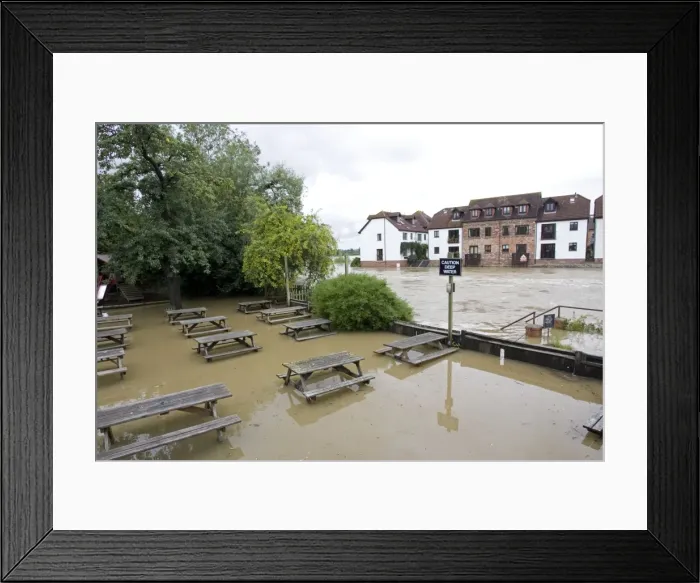Framed Print : Submerged picnic tables in pub alongside River Avon in flood from Mythe Bridge Tewkesbury Gloucestershire UK during unprecedented flooding of Rivons Avon and Severn above 1947 level Framed Print : Submerged picnic tables in pub alongside River Avon in flood from Mythe Bridge Tewkesbury Gloucestershire UK during unprecedented flooding of Rivons Avon and Severn above 1947 level