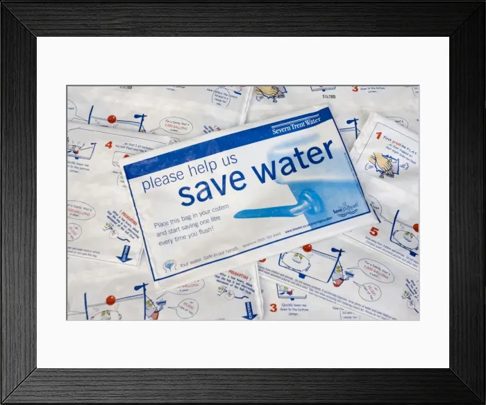 Framed Print : Water conservation - placing water hippo saveaflush bags, provided free by Severn Trent Water, in toilet cistern helps conserve water each time the toilet is flushed. UK Framed Print : Water conservation - placing water hippo saveaflush bags, provided free by Severn Trent Water, in toilet cistern helps conserve water each time the toilet is flushed. UK