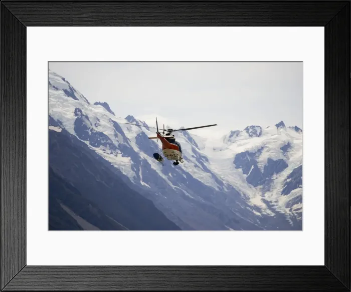 Framed Print : New Zeland - Helicopter flight over snow capped mountains and forested slopes in Aoraki - Mount Cook National Park. This spectacular wilderness area in South Island New Zealand has now been designated a World Heritage Site Framed Print : New Zeland - Helicopter flight over snow capped mountains and forested slopes in Aoraki - Mount Cook National Park. This spectacular wilderness area in South Island New Zealand has now been designated a World Heritage Site