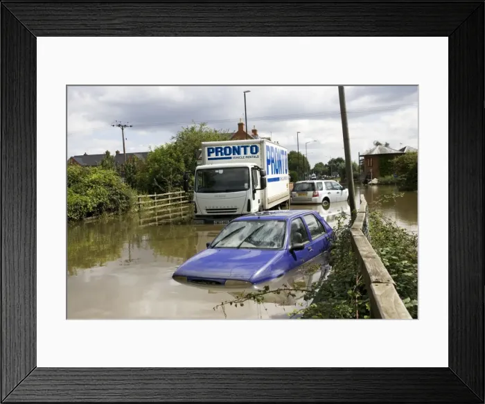 Framed Print : Flooding - cars and lorries partly submerged on flooded road into Newtown, Tewkesbury, Gloucestershire, UK following unprecedented flooding of Rivons Avon and Severn above 1947 level Framed Print : Flooding - cars and lorries partly submerged on flooded road into Newtown, Tewkesbury, Gloucestershire, UK following unprecedented flooding of Rivons Avon and Severn above 1947 level
