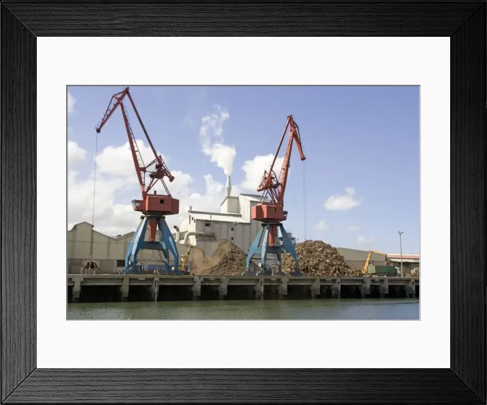 Framed Print : Cranes on quayside unloading scrap metal into trucks for reprocessing Bilbao docks Spain Framed Print : Cranes on quayside unloading scrap metal into trucks for reprocessing Bilbao docks Spain