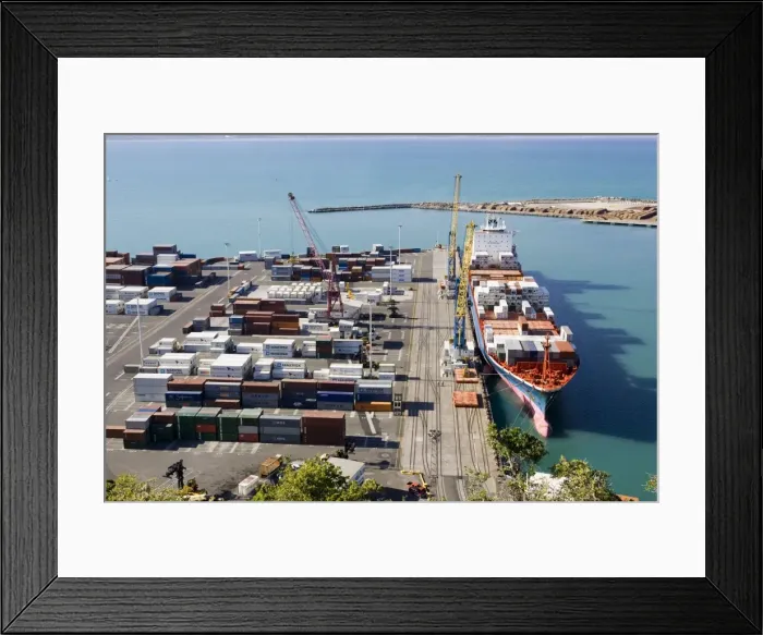 Framed Print : Harbour - containers stacked on quayside and container cargo ship in harbour and docks. Napier - North Island - New Zealand Framed Print : Harbour - containers stacked on quayside and container cargo ship in harbour and docks. Napier - North Island - New Zealand