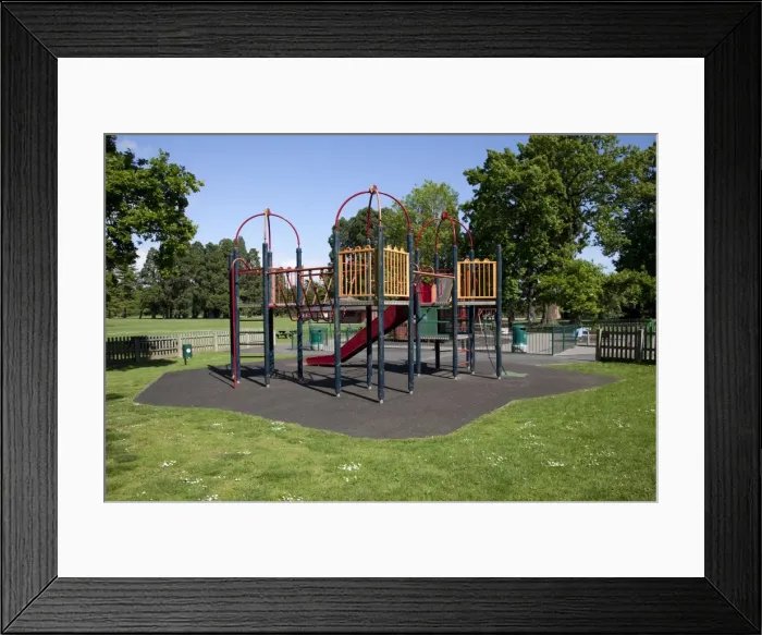 Framed Print : Childrens playground protected by safety matting made from old car tyres - Newport South Wales UK Framed Print : Childrens playground protected by safety matting made from old car tyres - Newport South Wales UK