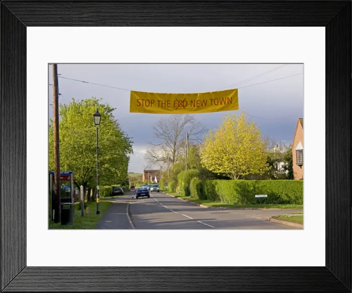 Framed Print : Stop eco new town banner across road Long Marston near Stratford UK Framed Print : Stop eco new town banner across road Long Marston near Stratford UK