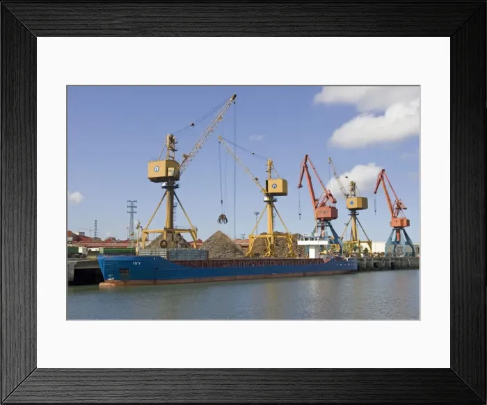 Framed Print : Cranes on quayside unloading scrap metal from cargo shipsinto trucks for reprocessing Bilbao docks Spain Framed Print : Cranes on quayside unloading scrap metal from cargo shipsinto trucks for reprocessing Bilbao docks Spain