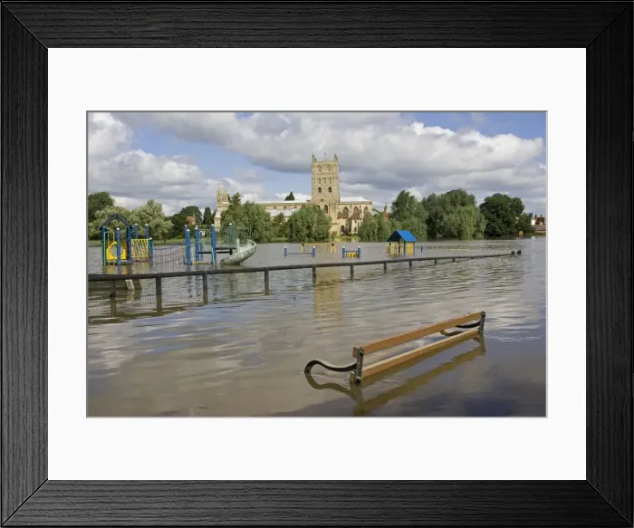 Framed Print : Flooding - childrens playground underwater with Tewkesbury Abbey in background. Unprecedented flooding of the Rivers Severn and Avon July 2007 Gloucestershire UK Framed Print : Flooding - childrens playground underwater with Tewkesbury Abbey in background. Unprecedented flooding of the Rivers Severn and Avon July 2007 Gloucestershire UK