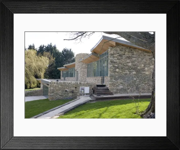Framed Print : Eco-friendly Home - new expensive upmarket innovative Cotswold stone house with large expanse of glass windows and turf roof in AONB conservation area - Cotswolds - UK Framed Print : Eco-friendly Home - new expensive upmarket innovative Cotswold stone house with large expanse of glass windows and turf roof in AONB conservation area - Cotswolds - UK