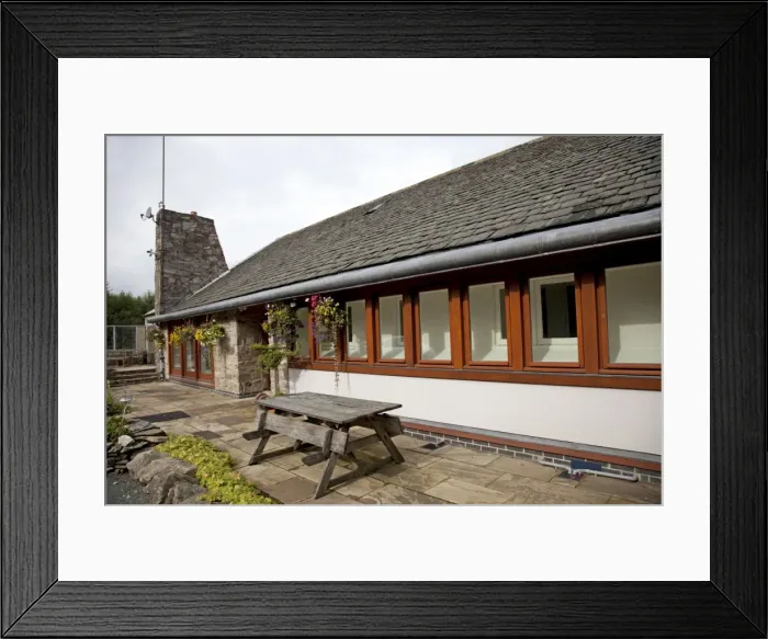 Framed Print : Eco-friendly Home - highly energy efficient bungalow with additional wall built of straw bales and rendered - UK Framed Print : Eco-friendly Home - highly energy efficient bungalow with additional wall built of straw bales and rendered - UK